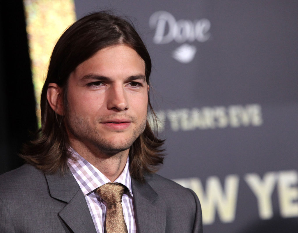 Ashton Kutcher is known for his long hair and charming personality.